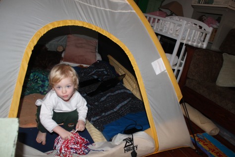 Mary Crockett, coauthor of Dream Boy, is a migratory writer. Any available space is fair game. When her husband set up a tent in her family room for the amusement of the kids, Mary moved in. (Note the laptop behind the two-year-old.) 